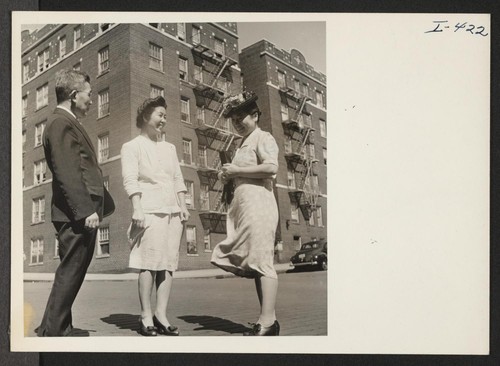 Mr. and Mrs. Misao Tajitsu, Issei from the Minidoka Relocation Center, are chatting in front of their New York City
