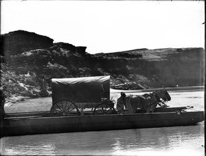 Wagon on a ferry crossing the upper Colorado River at Lee's Ferry, Grand Canyon, 1900-1930