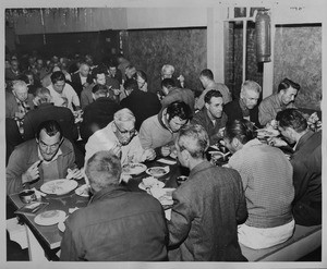 Men eating hearty Xmas dinner, Union Rescue Mission, Los Angeles, 1960