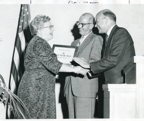 Mrs. Pepperdine receiving an award on the 25th anniversary of Pepperdine College. Donald Miller (C), Dr. M. Norvel Young (R)