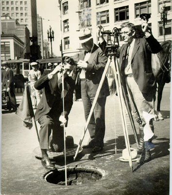 [Three men conducting a subway study on Market Street at Sutter]