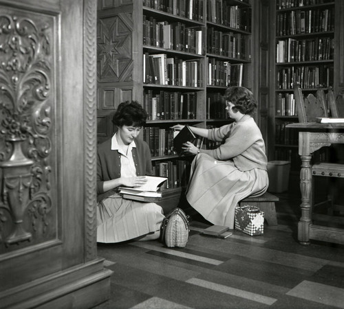 Two students in Denison Library, Scripps College