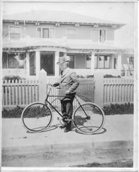 Luther Burbank with his bicycle in front of his home on Tupper Avenue in Santa Rosa California, about 1910