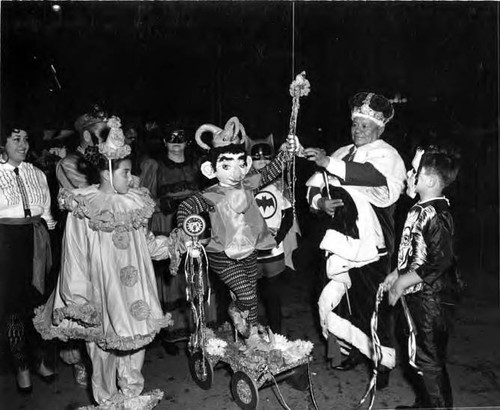 King with children in costume in Mardi Gras event