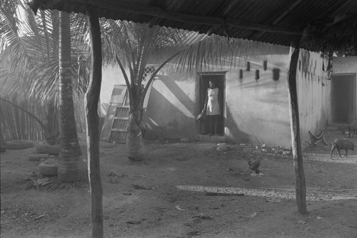 Woman standing at doorway, San Basilio de Palenque, ca. 1978