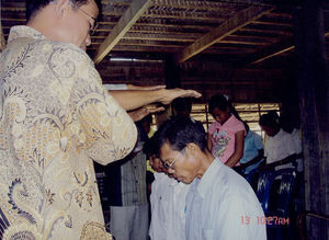 Church members praying for the three installed church workers on Nov. 13, 2005