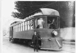 Motorman Bill Parks and Conductor Chris Christensen with Petaluma & Santa Rosa Railroad Co. passenger car No. 57 on South Main Street, Sebastopol, California