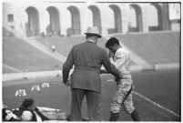 Loyola Lions' head coach Tom Lieb and player, during game against Santa Clara's Broncos, Los Angeles, 1937