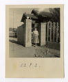 Young woman standing outside building