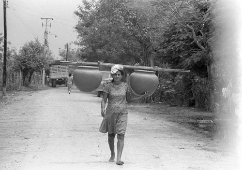 Transporting clay goods, La Chamba, Colombia, 1975