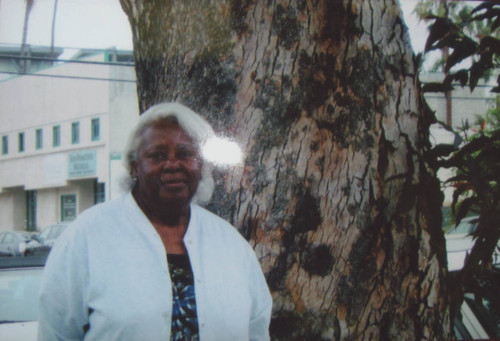 Celestine 'Suzie' Clisby Ellis in front of 'Suzie's tree' on Broadway between 18th and 19th Streets