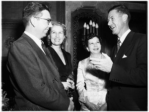 The Denis Alexanders give cocktail party at the home of her parents, the James Wendell Hunts, 1951