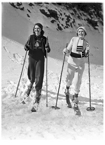 Two women standing in ski gear and wearing winter wear in Big Pines Camp