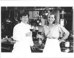 Chef Charlie Trotter and wine maker Gina Gallo toasting each other with glasses of wine, Sonoma County, California