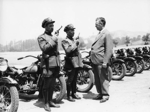 Two motorcycle officers at attention