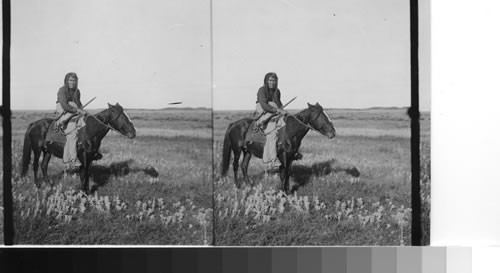Indian on Horseback. Alberta. Canada