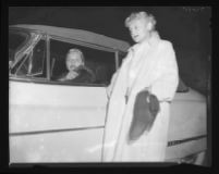 Barbara Payton in car on her way to board plane, with Mrs. Kent Modglin, 1951