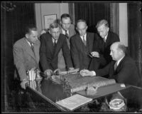 Los Angeles County Flood Control District engineers view plans with Supervisor Roger Jessup, Los Angeles, 1930