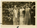 Beatty standing with two women