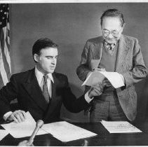 Dr. S.I. Hayakawa, Senator-elect from California, with Gov. Jerry Brown, who is signing a certificate giving him extra seniority