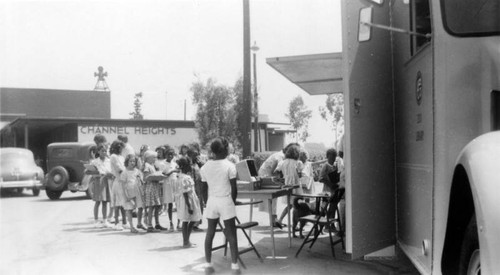 Early readers at the LAPL Traveling Branch Bookmobile