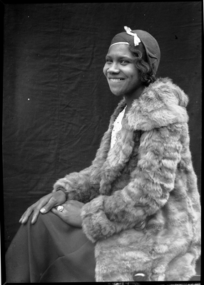 Portrait of woman in fur coat and cloche hat