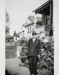 Edward L. Anderson stands by the Oster home in Petaluma, California, April 15, 1940