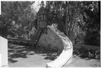 Slide on 4-year-old Gloria Lloyd's private mini-estate on her parent's sixteen-acre estate, Beverly Hills, 1927