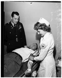 Blood donors get "Fixed Bayonets" tickets, 1951