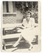 Geraldine Bliss Brooke seated at picnic table