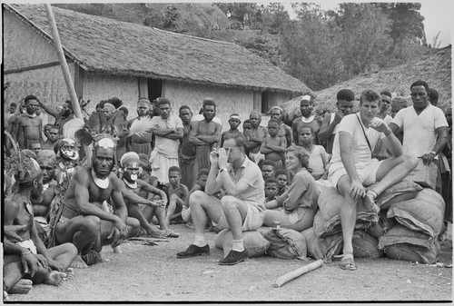 Government-sponsored festival in Tabibuga: teacher Peter Stubbs, Nancy Cook, and patrol officer John (Jack) Edwards (l to r) with luluais and other people