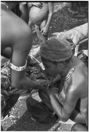 Bride price ritual: feeding blood pudding to affinal kin