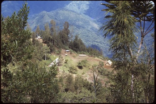 Kwiop, aerial view of church, store, and other buildings