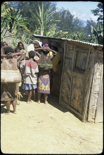 Customers at small tradestore in Duwai