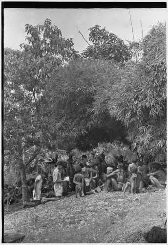 Church service in Kwiop: Solomon Islander mission workers and children kneel