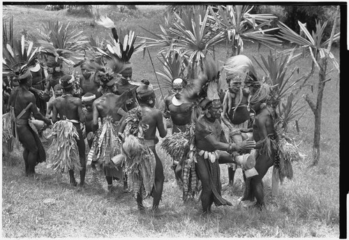 Church service in Kwiop: decorated men dance with kundu drums