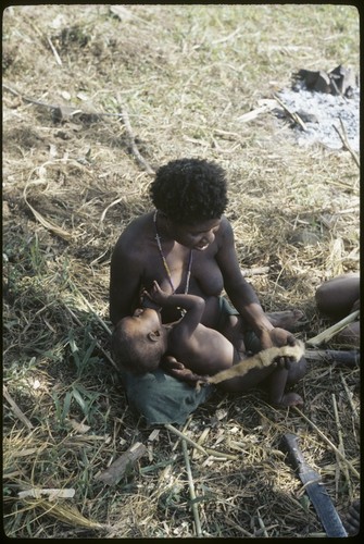 Woman breastfeeds infant