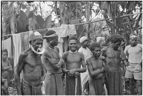 Returned laborers, purification ritual: tearful older men address ancestors, thanking them for caring for men who have been away