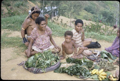 Tabibuga: women selling sweet potatoes, greens and other garden produce at market