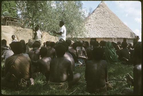 Meeting at Kwiop: local government councillor Mai Kopi standing in center