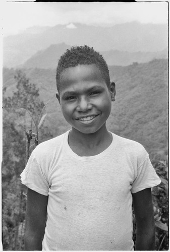 Boy wearing a shirt, smiles