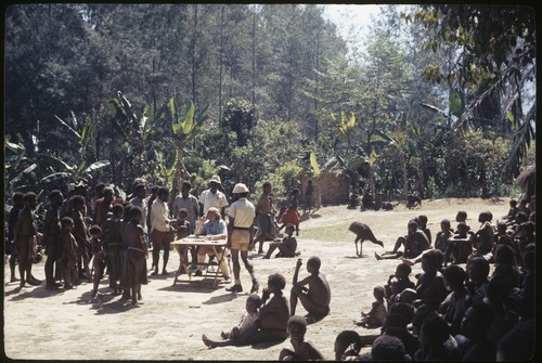 Kwiop census, people wait to be counted by visiting patrol officer