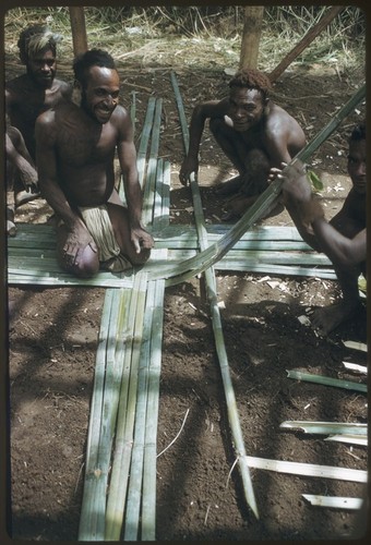 House-building: Kwiop men weave wall panels for the Cooks' house