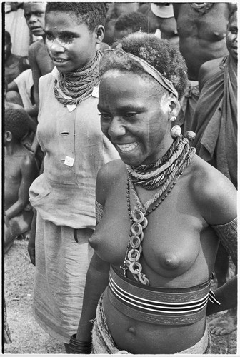 Government-sponsored festival in Tabibuga: adolescent girl with tattooed face, snail shell earrings, trade beads, white powder on face and hair