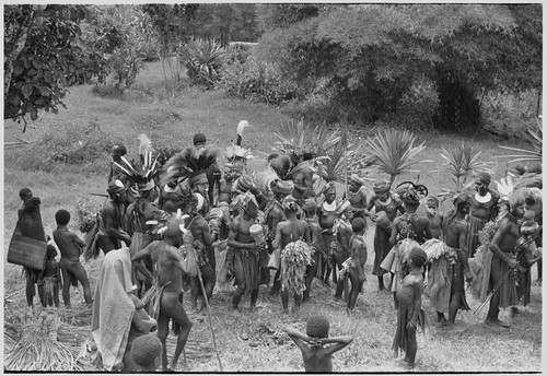 Church service in Kwiop: decorated men dance and play kundu drums at church service