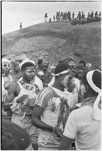 Government-sponsored festival in Tabibuga: young men, wearing Western clothing, play drums