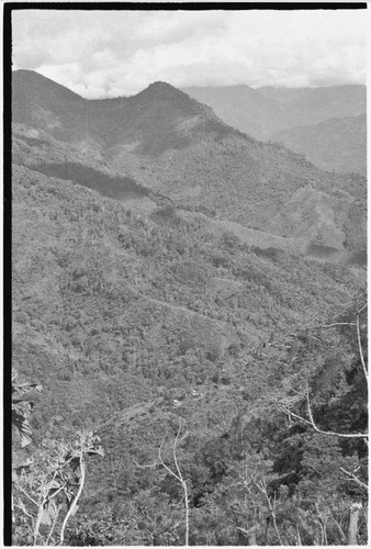 Bismarck Range mountains: houses and trails in lower frame