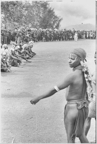 Government-sponsored festival in Tabibuga: crowd gathered around field, watching athletic competitions