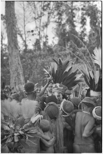 Bride price ritual: bride (center) and crowd of kin