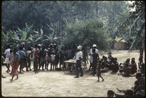 Kwiop residents line up for census taken by patrol officer